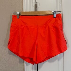 Athleta x Allyson Felix Legend Run With It Short in a bright orange